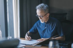 senior-signing-legal-documents-trust-funds